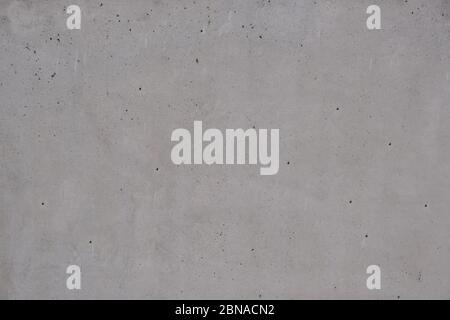 Struttura di fondo in calcestruzzo. Materiale in calcestruzzo liscio esposto, parete o pavimento dell'edificio, colore grigio Foto Stock