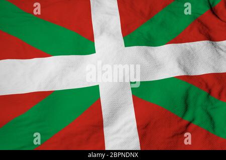 Primo piano su un'onda della bandiera basca (ikurrina) nel rendering 3D. Foto Stock