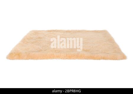 Tappeto in pelliccia beige. Isolato su bianco Foto Stock
