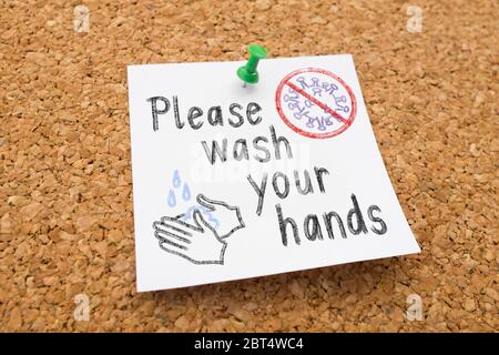 Nota su bacheca 'Lavare le mani' contro lo scoppio e lo spargimento di Coronavirus Foto Stock