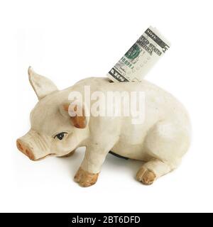 US 5 Dollar nota nella scanalatura di una banca del piggy Foto Stock