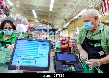 Miami Beach Florida, supermercato Publix alimentari negozio di alimentari, Covid-19 coronavirus Pandemic crisi malattia, infezione contagiosa malattia prevenzione, cassiere Foto Stock