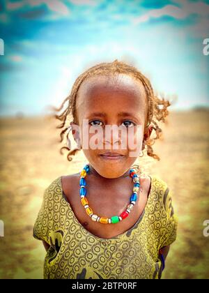 Bambina piccola con collana, depressione Danakil, Afar Regione, Etiopia, Africa Foto Stock