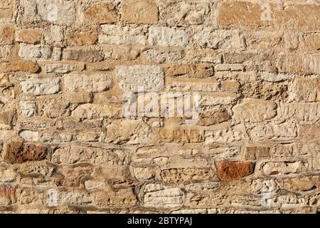 Dettaglio delle tradizionali mura in pietra a Burford, Cotswolds, Inghilterra, Regno Unito Foto Stock