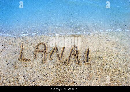 Le lettere disegnate con le dita resistono al leggero riflusso e al flusso delle acque dell'Oceano Pacifico che circondano le isole hawaiane. Lanai ha la sua propria Foto Stock