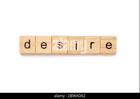 Piastrelle di legno lettera che ortografia la parola DESIDERIO Foto Stock