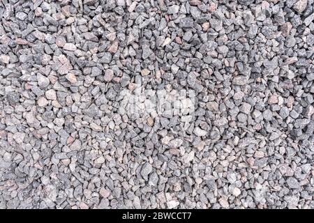 Fondo grigio. Fondo grunge. Pietra finemente frantumata Foto Stock