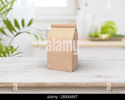 Il design mock-up del sacchetto del fascio di caffè e il tavolo di legno in kichen Foto Stock