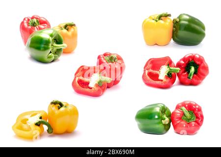 Set di peperoni rossi, gialli e verdi isolati su sfondo bianco. Foto Stock