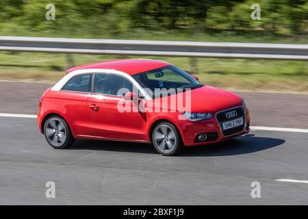 2013 Red Audi A1 Sport TFSI; veicoli veicolari in movimento, automobili che guidano veicoli su strade del Regno Unito, motori, motori sull'autostrada M6 Foto Stock