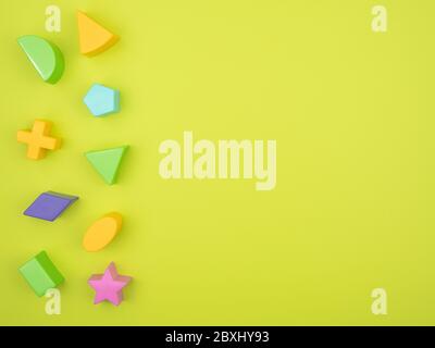 Geometric shapes of different shapes and colors on a green background. Foto Stock