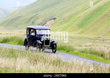 MOFFAT, SCOZIA - 29 GIUGNO 2019: Austin sette auto in un rally auto classico in rotta verso la città di Moffat, Dumfries e Galloway Foto Stock