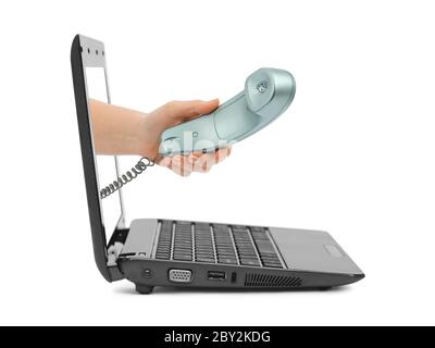 Mano con telefono e notebook Foto Stock