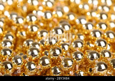Molte palline dorate Foto Stock