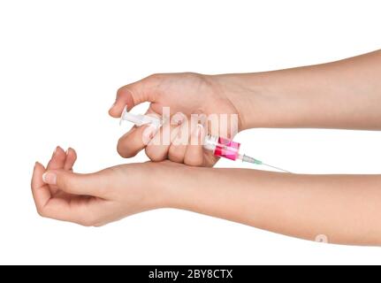 Mano con siringa Foto Stock