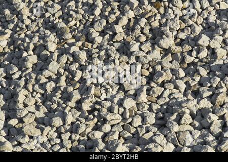 grande consistenza di pietra frantumata. Pietre di ghiaia piccole sul cantiere. Ghiaia pietre di ghiaia sfondo. Foto Stock