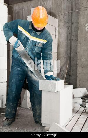 Costruzione mason lavoratore muratore Foto Stock