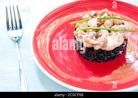 Il riso nero con crema di salmone e prezzemolo Foto Stock