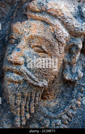 Faccia il carving in pietra scultura al tempio di Borobudur Foto Stock