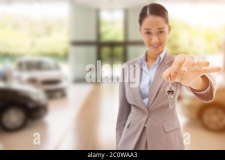 Immagine composita del ritratto di un sorridente imprenditrice tenendo premuto un tasto Foto Stock