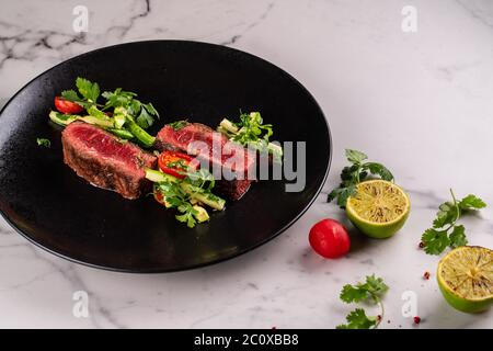 Ottima cucina con carne di cervo e verdure Foto Stock
