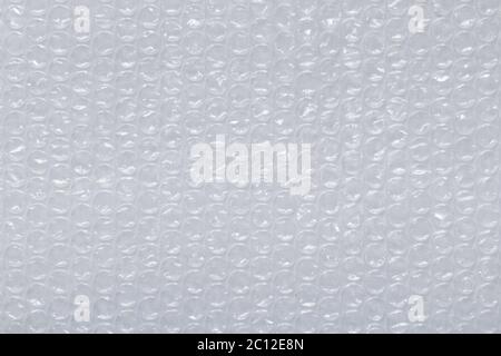 Materiale di rivestimento a bolle d'aria in plastica per la protezione del contenitore Foto Stock