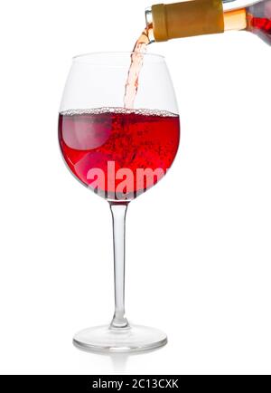 Il vino rosso è versata nel bicchiere Foto Stock