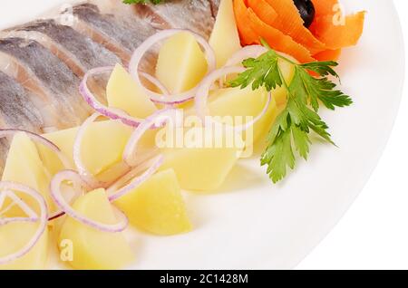 Aringhe salate con patate bollite Foto Stock