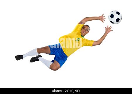 Calcio brasiliano player, saltando, giallo e blu Foto Stock