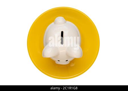 Banco di piggy sulla piastra gialla Foto Stock