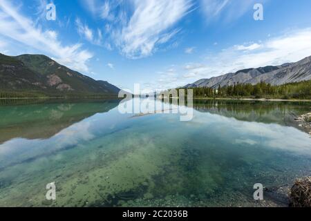 Reflections at Lake Muncho in Canada Stock Photo