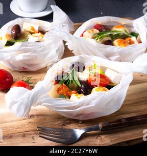 gnocchi al forno con pomodori zucchini e formaggio di pecora a dadini Foto Stock