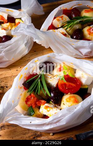 gnocchi al forno con pomodori zucchini e formaggio di pecora a dadini Foto Stock