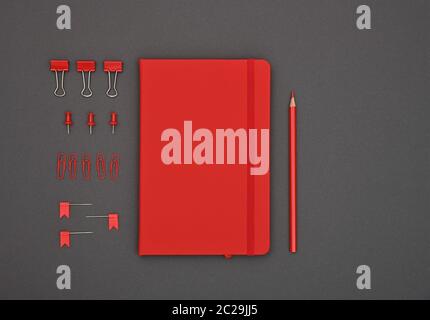 Ben organizzato red stationery piana di laici notebook, matita, office clip, leganti e perni in ordine su sfondo grigio scuro, elevati vista dall'alto, di Foto Stock