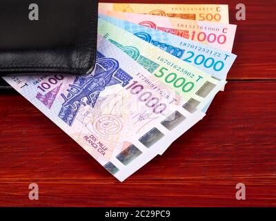 West African denaro nel portafoglio nero Foto Stock