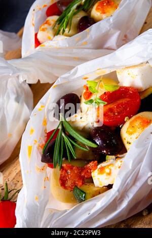 gnocchi al forno con pomodori zucchini e formaggio di pecora a dadini Foto Stock
