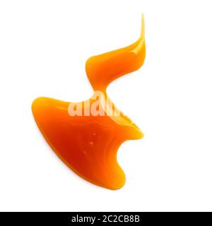 salsa dolce al caramello isolata su bianco Foto Stock