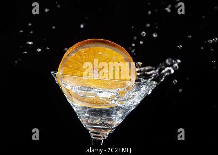 Arancio, vetro, ghiaccio e acqua Foto Stock
