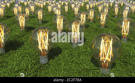 La lampadina luminosa si sviluppa da un terreno coperto di erba. Fonti energetiche rinnovabili alternative. Produzione di elettricità da terra. Creativo concettuale i Foto Stock