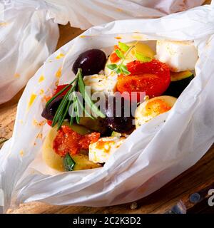 gnocchi al forno con pomodori zucchini e formaggio di pecora a dadini Foto Stock