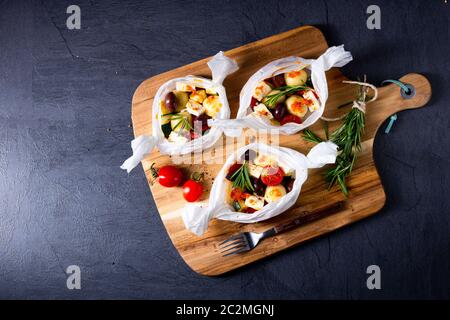 gnocchi al forno con pomodori zucchini e formaggio di pecora a dadini Foto Stock