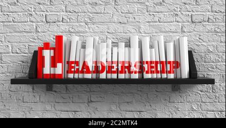 Leadership - Red Inscription sui libri su scaffale sulla parete bianca del mattone sfondo. Concetto di istruzione. Foto Stock