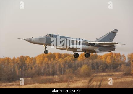 Military jet bomber Su-24 Fencer flying Stock Photo