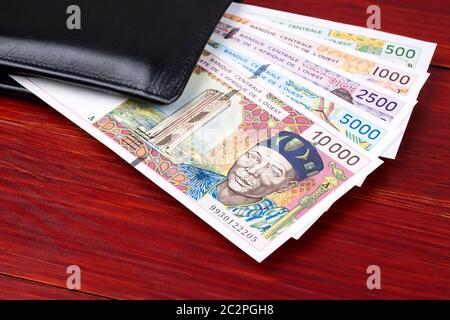 Il vecchio West degli Stati africani denaro nel portafoglio nero Foto Stock