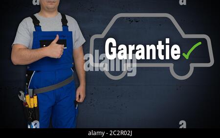 Garantie (in tedesco) Garanzia auto e artigiano con pollice in alto. Foto Stock