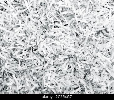 Sullo sfondo di un mucchio di bianco SHREDDED PAPER Foto Stock