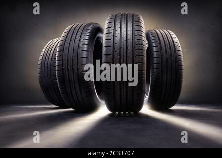 primo piano di quattro pneumatici contro il nero Foto Stock