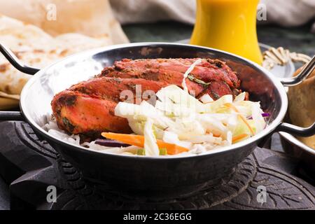 Primo piano di un piatto di pollo tandoori tritato Foto Stock