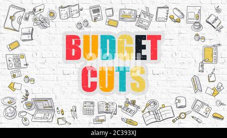 Concetto di tagli al budget. Illuminazione moderna. Tagli di bilancio multicolore disegnati su muro di mattoni bianchi. Icone di Doodle. Stile di progettazione Doodle di Budget Cut Foto Stock