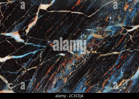 Un nero blu arancio modellato sullo sfondo di marmo Foto Stock